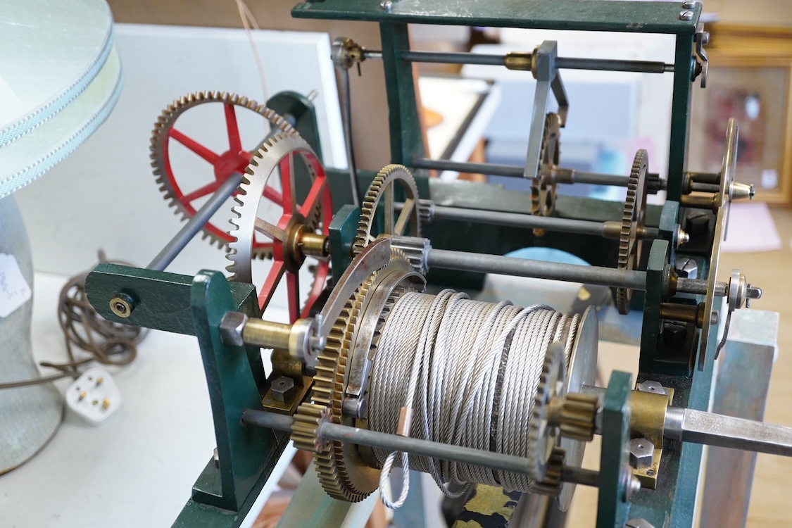 A late 19th century turret timepiece, understood to have been possibly built by Kemp of Bristol, green painted cast iron frame, with pendulum, weight, winding handle, and other unrestored parts, including the drive mecha